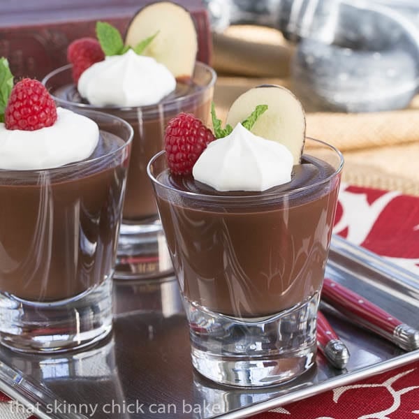 Double Chocolate Pudding - Creamy, luscious comfort food Double Chocolate Pudding in highball glasses topped with cream, berries and mint.