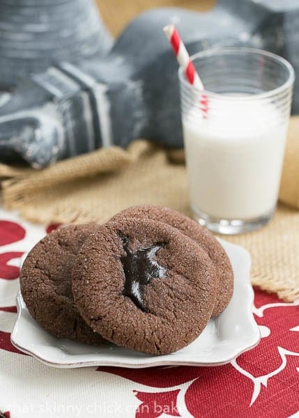 Chocolate Lava Cookies plated with a glass of milk.