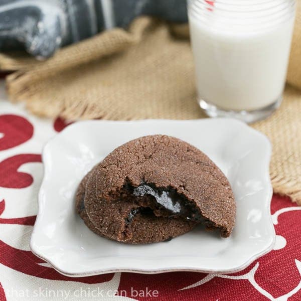 Chocolate Lava Cookies broken in half to expose fudge filling.