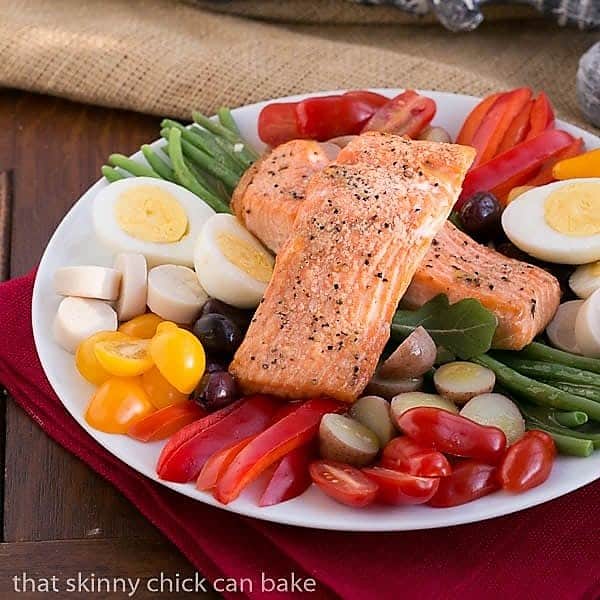 Salmon Salad Nicoise on a white serving plate.