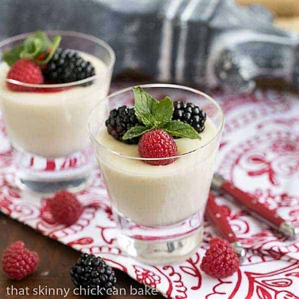 Cooked Cream AKA Panna Cotta is a luscious, tasty Italian dessert 2 servings Vanilla Bean Panna Cotta garnished with berries and mint.