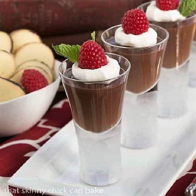Rich Double Chocolate Pudding - Creamy, luscious comfort food Rich Double Chocolate Pudding in shot glasses on a white tray.