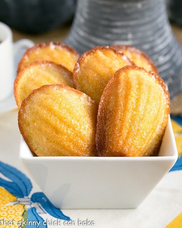 Lemon Madeleines in a square white bowl.