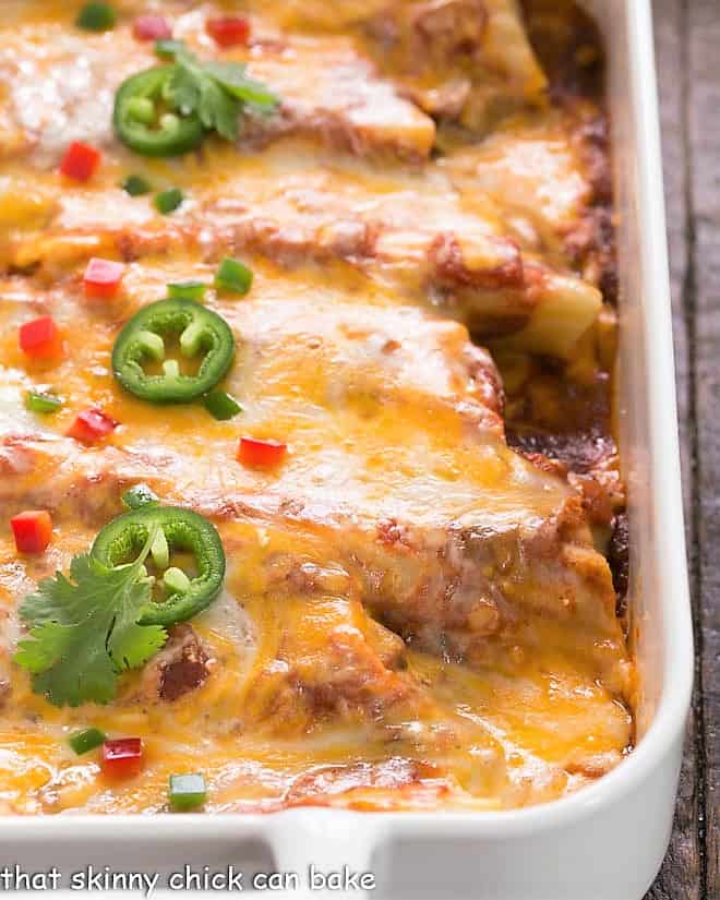 Close up of chicken manicotti in a white casserole dish