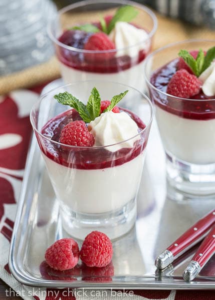 Side view of a tray of Raspberry White Chocolate Cheesecake Parfaits.