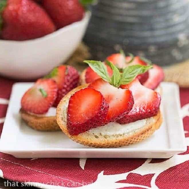 Strawberry Basil Crostini on a small white appetizer plate 