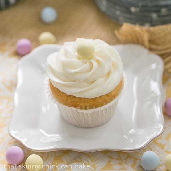 Buttercream Topped Vanilla Cupcakes - Delightfully delicious vanilla cupcakes! Homemade Vanilla Cupcakes on a small white plate.