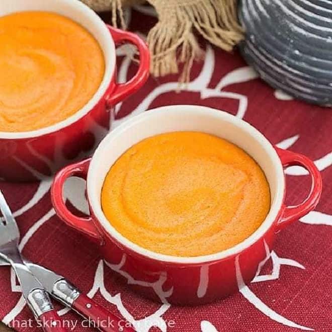 Carrot Puff - A lovely twist for your vegetable course Carrot Puff in two small red baking dishes over a red and white napkin.