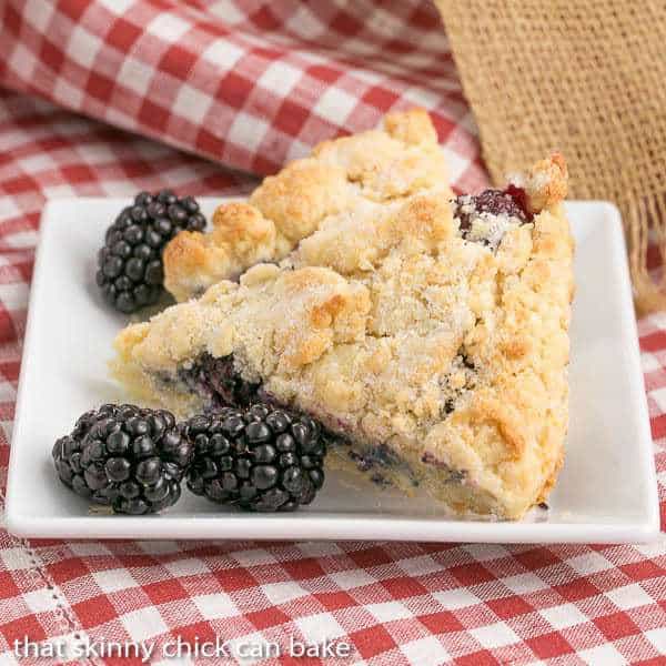 Fresh Blackberry Scones with Cream - Moist, scrumptious and packed full of berries Fresh Blackberry Scones with Cream on a white square plate.