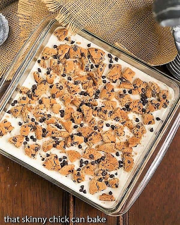 Milk & Cookies Lasagna - A dreamy, decadent layered, no-bake dessert! Overhead view of Milk & Cookies Lasagna in a square, glass pan.