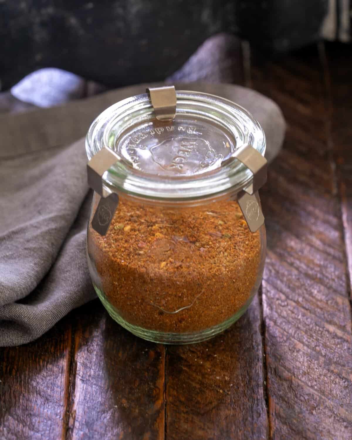 Homemade Taco Seasoning - So easy and delicious that you'll never buy a seasoning packet again! Taco seasoning in a glass storage container.
