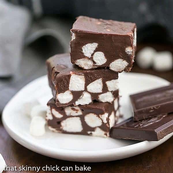 Chocolate Marshmallow Fudge - Only 3 ingredients and a few minutes to have a batch of super rich, delicious fudge! Chocolate Marshmallow Fudge stack on a small white plate.