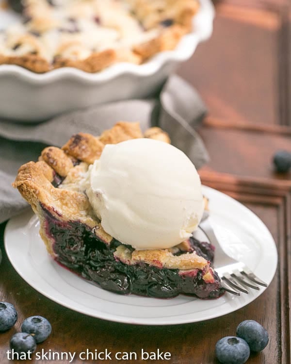 Slice of a Freeze and Bake Blueberry Pie topped with ice cream
