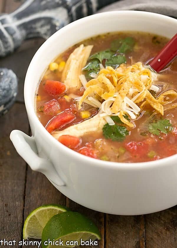 Leftover Turkey Tortilla Soup - A hearty soup that utilizes leftover turkey! Leftover Turkey Tortilla Soup in a white terrine.