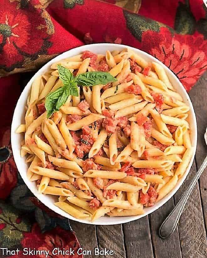 Penne alla Vodka - A simple, comforting pasta dish with tomatoes, cream and vodka! Penne alla Vodka view from above in a white serving bowl.