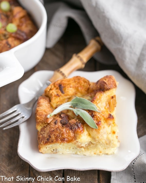 Sausage Croissant French Toast Casserole serving on a small white plate.