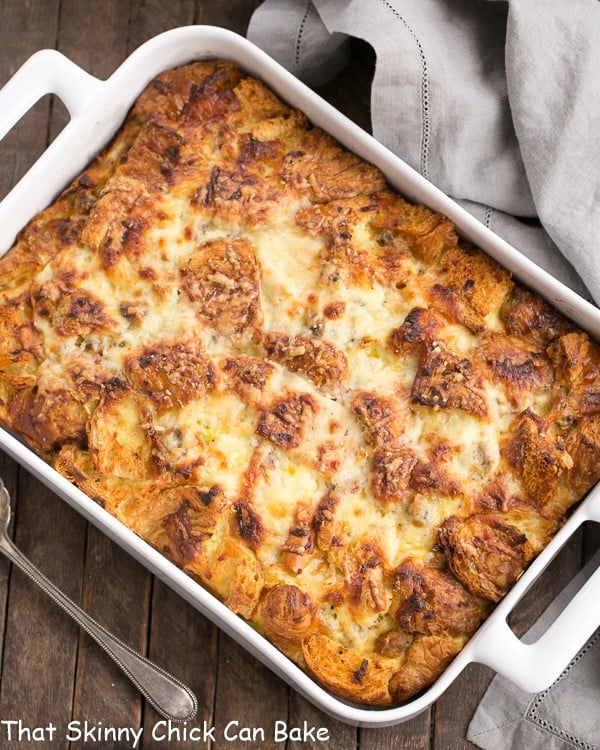 Overhead view of Sausage Croissant French Toast Casserole in a white baking dish.