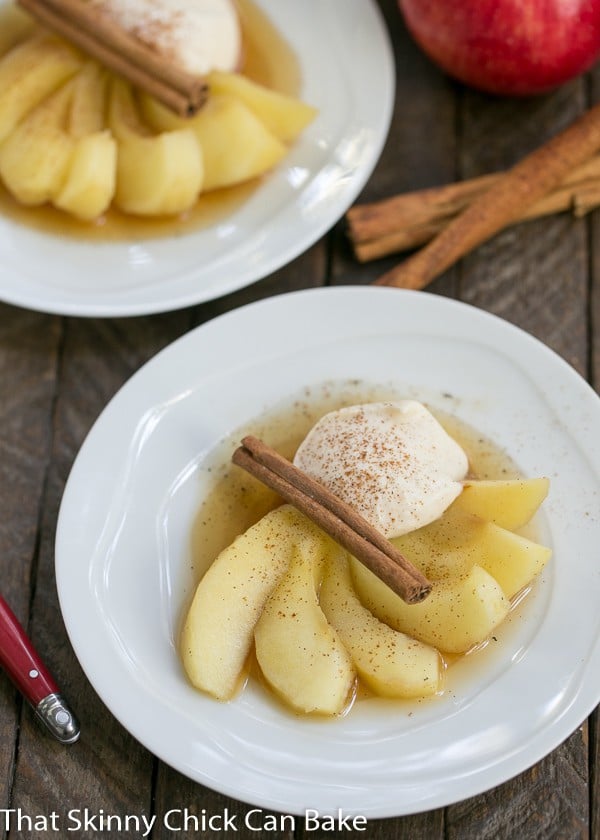 Tea Poached Apples fanned out on dessert plates.