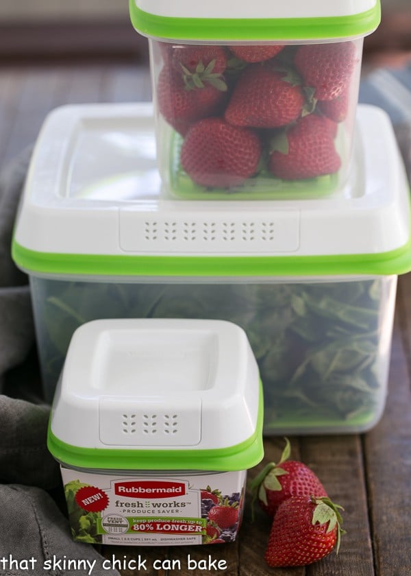 Strawberry Bacon Brie Salad - A spectacular combination of ingredients tossed in a strawberry balsamic vinaigrette Strawberry Bacon Brie Salad ingredients in plastic containers.