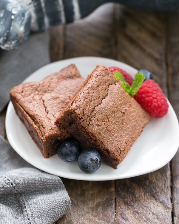 Simple Fudgy Brownies garnished with berries.