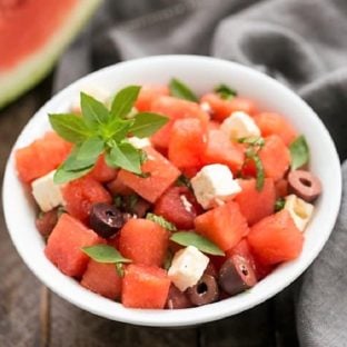 Watermelon Feta Basil Salad with Balsamic Vinaigrette in a white bowl