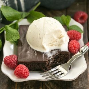 A close up of a piece of chocolate sheet cake on a plate
