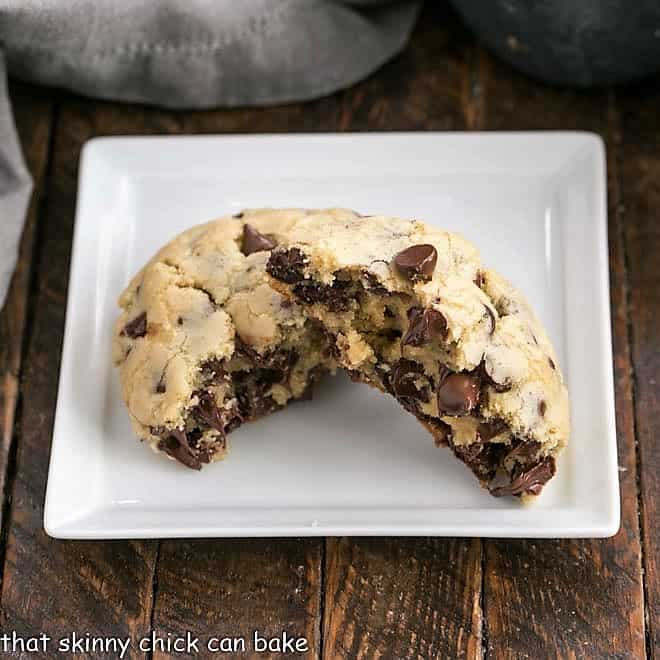 Levain Chocolate Chip Cookies - Huge chocolate chip cookies like the famous Levain Bakery cookies! Levain Chocolate Chip Cookie broken in half on a square white plate.