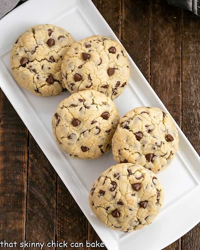Levain Cookie recipe- Huge chocolate chip cookies like the famous Levain Bakery cookies! overhead view of big chocolate chip cookies on a white tray.