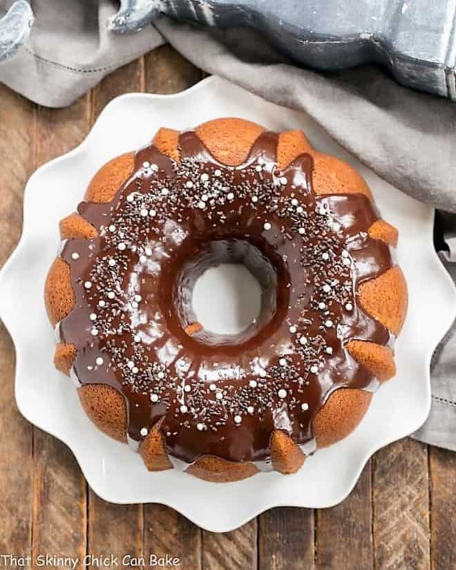 Overhead view of Tunnel of Fudge Cake on a white ripple edge plate.