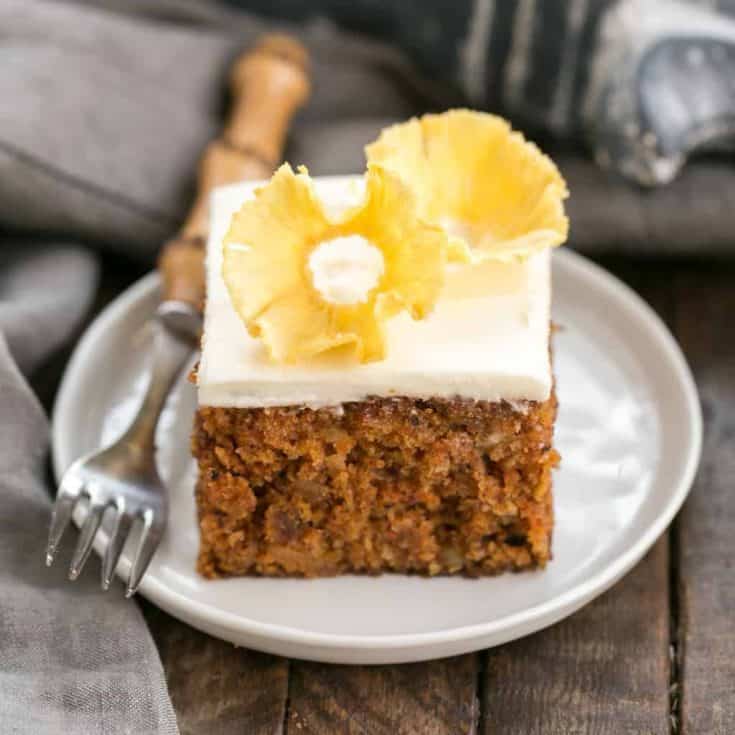 Old Fashioned Carrot Cake with Pineapple Flowers | A dreamy, loaded carrot cake with cream cheese frosting and a beautiful pineapple garnish