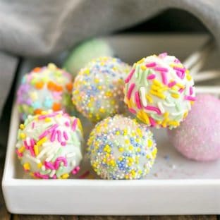 Easter Cake Pops resting on a square plate