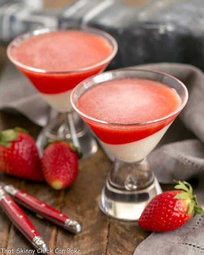  Two Vanilla Panna Cotta with Strawberry Gelée in martini glasses.