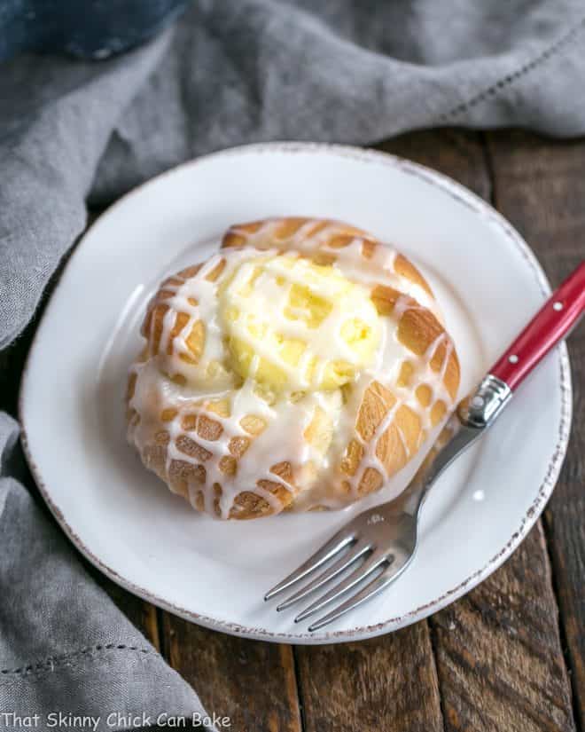 Overhead view of a Danish Twists with Cream Cheese Filling on a white breakfast plate.