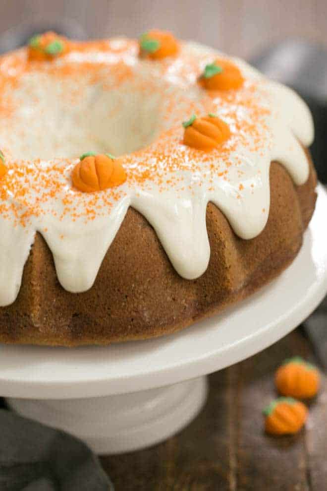 Pumpkin Spice Bundt Cake on a white ceramic cake stand.