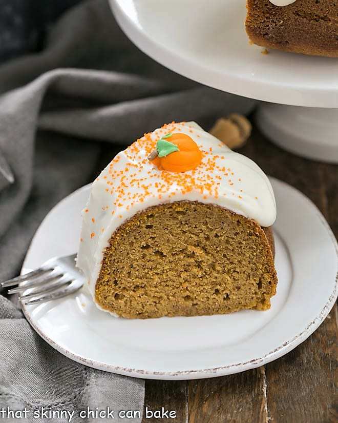 Slice of Pumpkin Spice Bundt Cake on a white dessert plate.