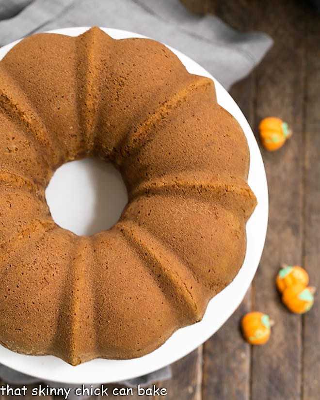 Pumpkin Spice Bundt Cake on a white cake plate.