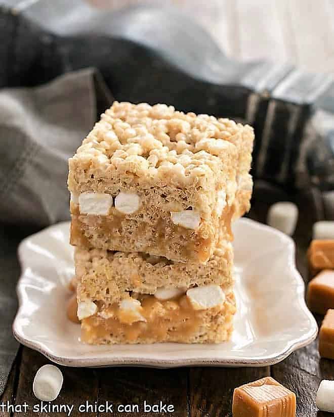 Caramel Stuffed Rice Krispie Treats on a square white plate.