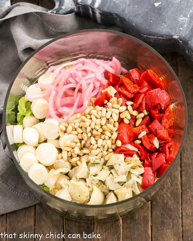 Italian Chopped Salad ingredients in a glass salad bowl.