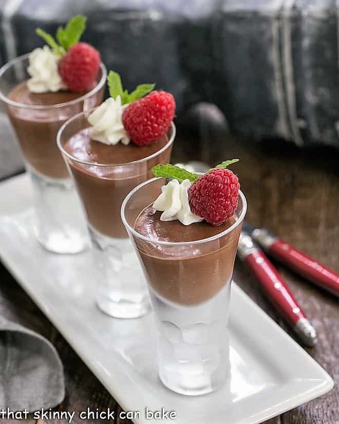 Blender Chocolate Mousse - The easiest chocolate mousse ever!!! Blender Chocolate Mousse in cordial glasses on a white tray.