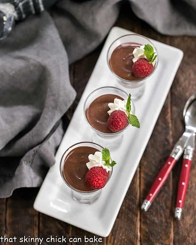 Blender Chocolate Mousse - The easiest chocolate mousse ever!!! Overhead view of Blender Chocolate Mousse lined up on a white ceramic tray.