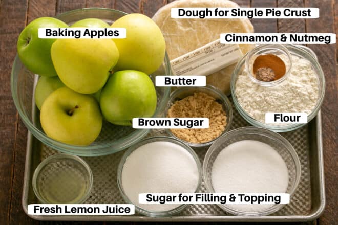 Ingredients for Dutch apple pie on a sheet pan with labels.