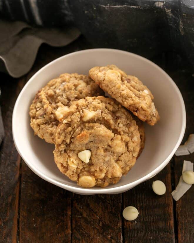 3 Oatmeal Toffee Cookies in a small white ceramic bowl.