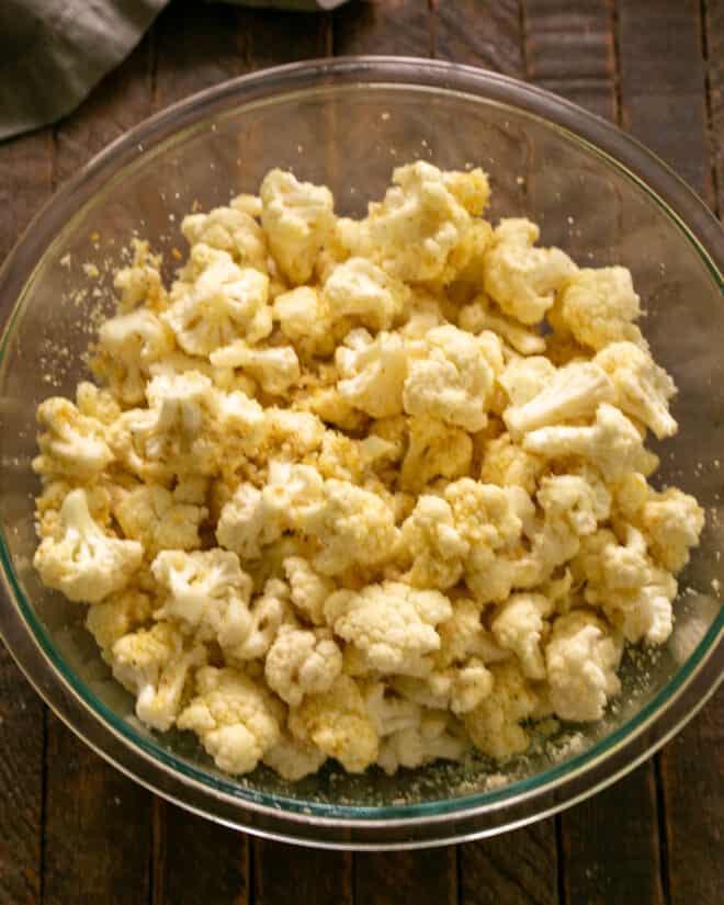 Bowl of cauliflower with bread crumbs and Parm added.