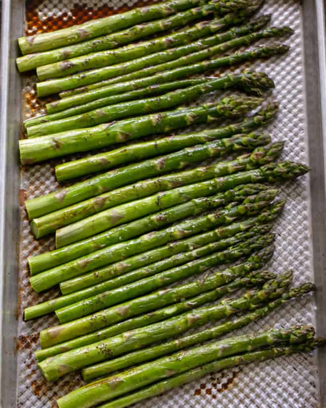 Roasted asparagus on a sheet pan.