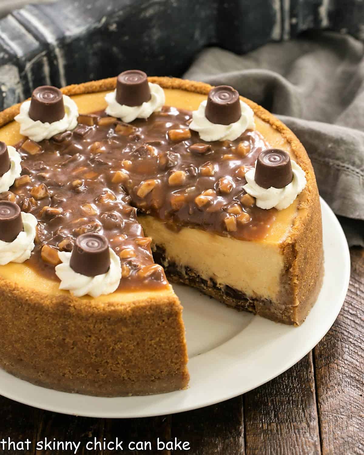 Caramel cheesecake on a white serving plate with a slice removed