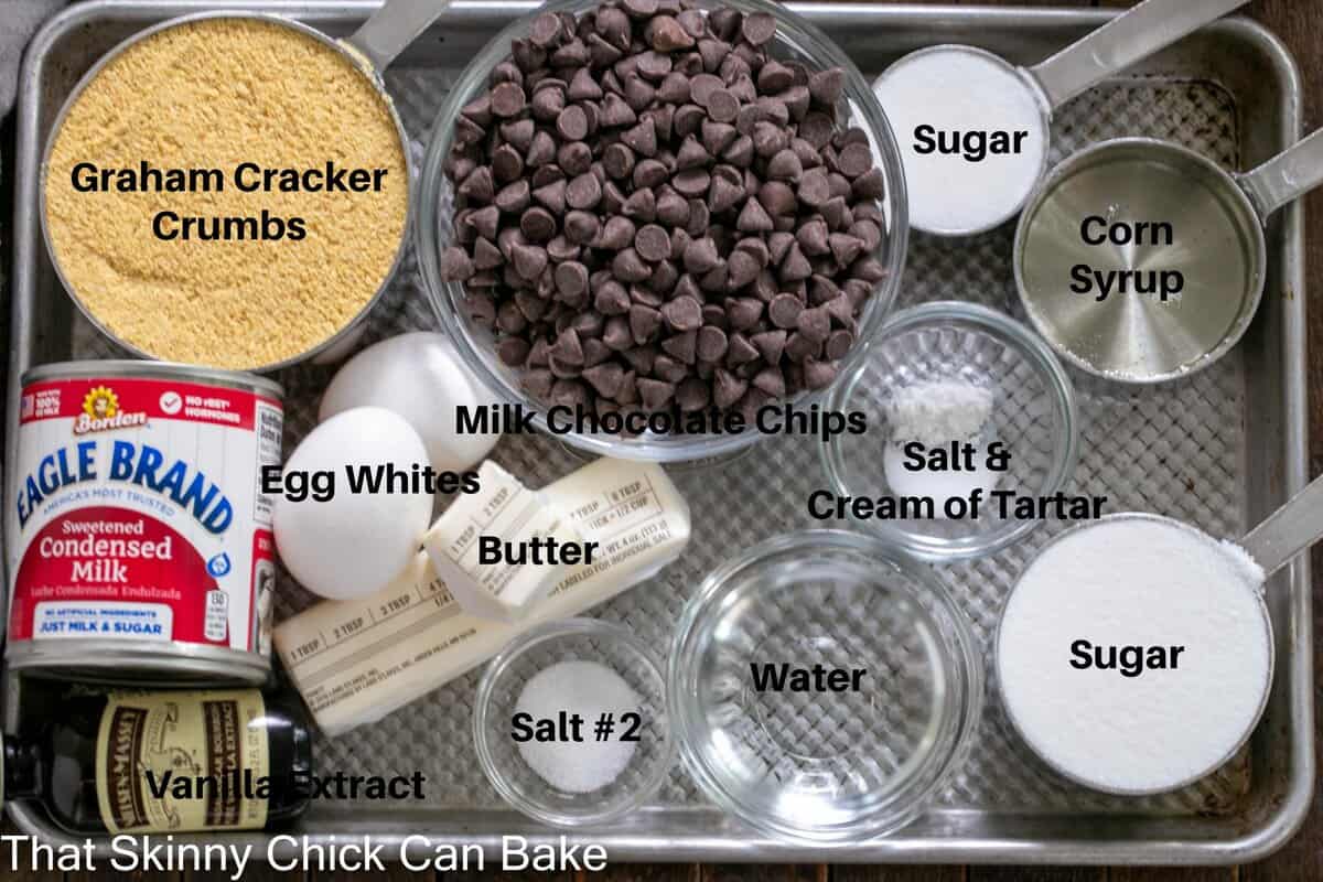 S'mores Fudge Bars ingredients on a sheet pan with labels.