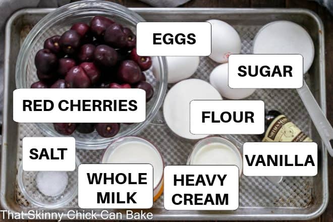 Cherry Clafoutis ingredients with labels on a sheet pan.