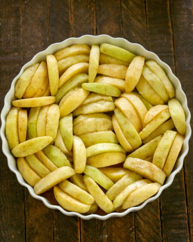 Apples added to baking dish.