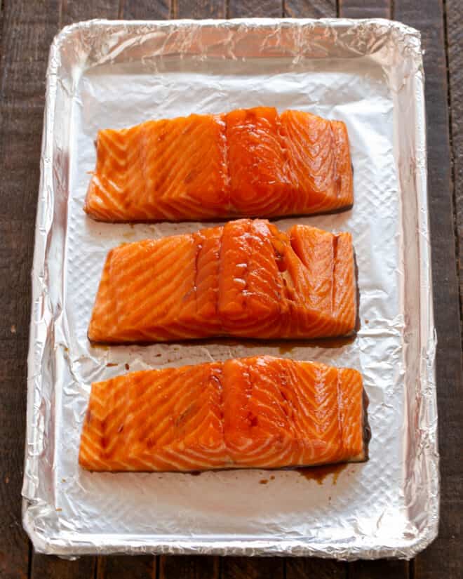 Marinated salmon on a sheetpan.