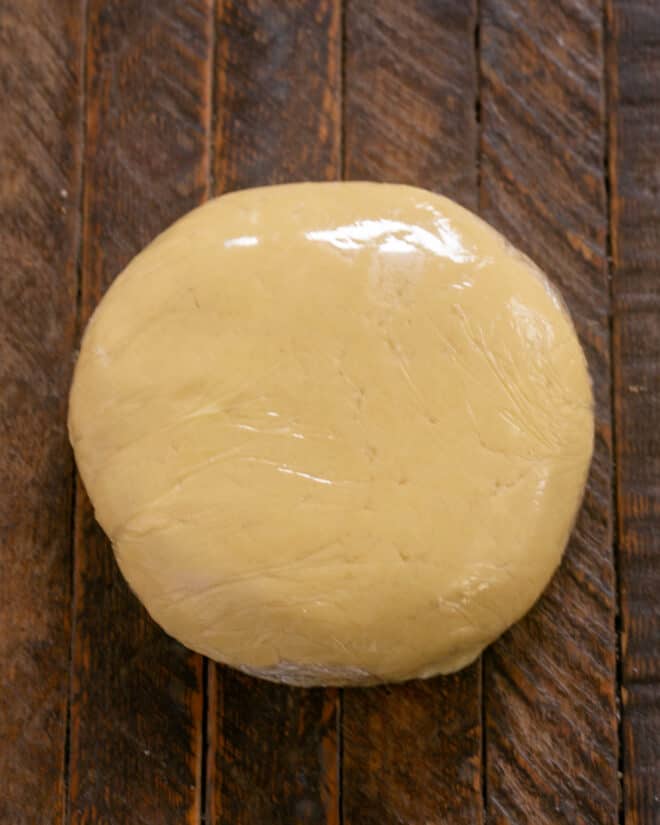 Dough wrapped in plastic.